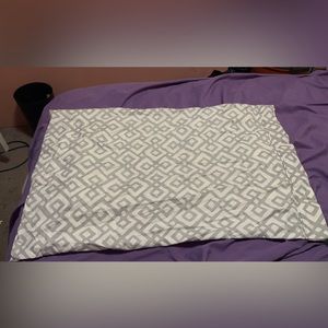 Grey and white pillowcase and sheet